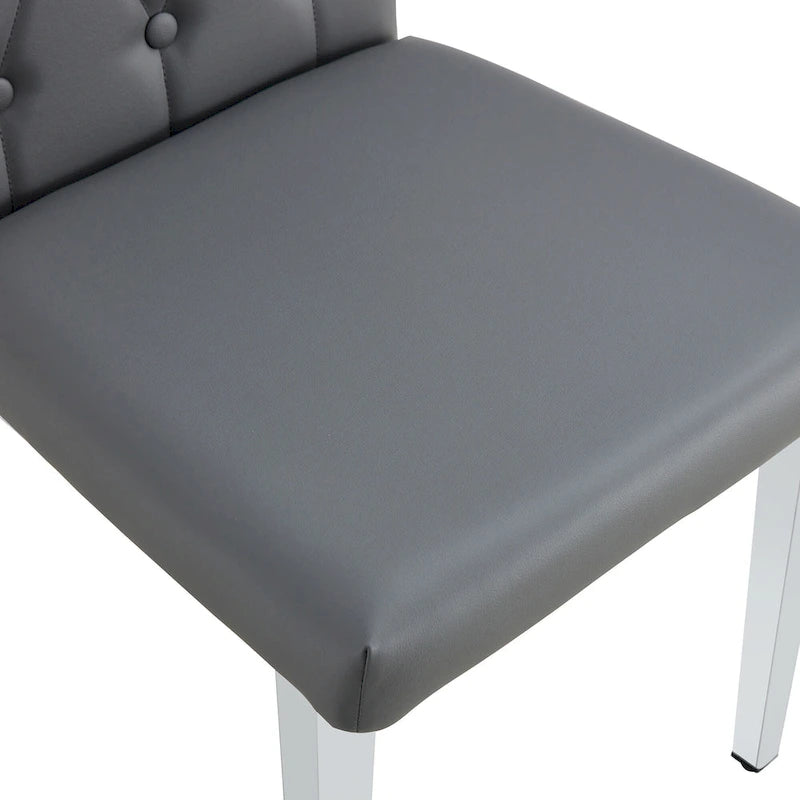 Cet ensemble de 4 chaises de salle à manger grises sans accoudoirs apporte une touche d'élégance et de mystère à la salle à manger grâce à son ton gris profond.